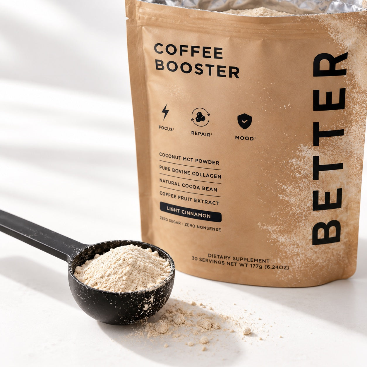 Better Coffee Booster pouch with a scoop of powder